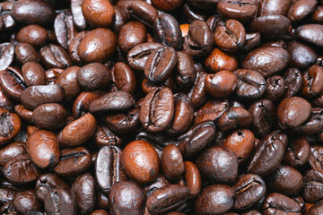 Image of black ground coffee beans, freshly roasted, ground coffee