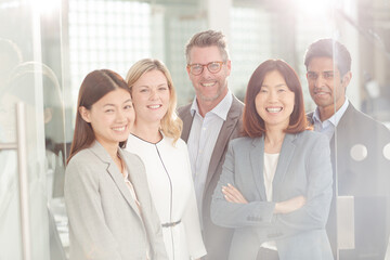Portrait of confident business people in sunny office