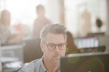 Fashion designer working at computer in office