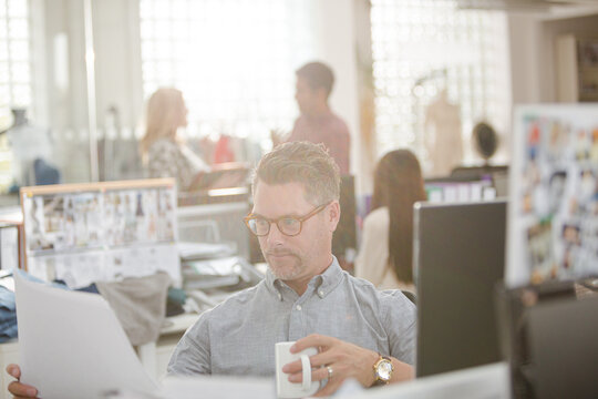 Fashion designer working at computer in office