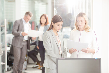 Businesswomen talking in office