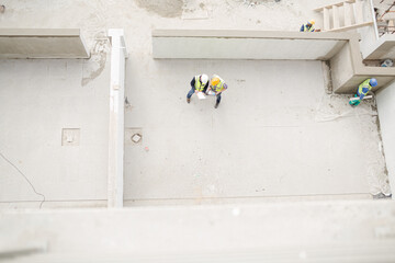 Overhead view of construction workers at construction site