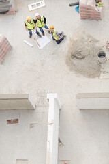 Overhead view of construction workers at construction site