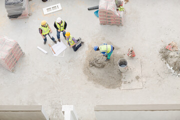 Overhead view of construction workers at construction site