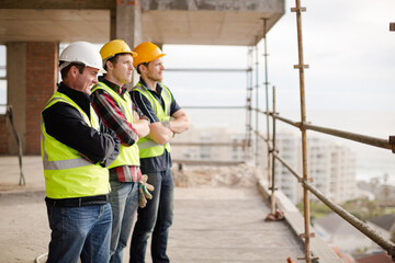 Construction workers at highrise construction site