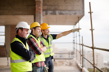 Construction workers at highrise construction site