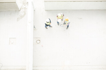 Overhead view of construction workers at construction site