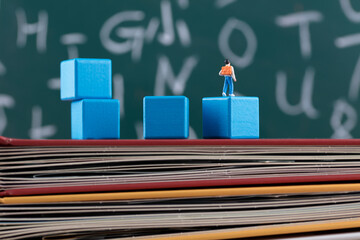 Pupils on building blocks in front of blackboard © zhenya