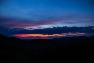 sunset, mountains, valleys, landscape, golden hour, orange sky.
blue and orange sky