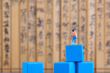 Primary school students on miniature creative blocks face bamboo slips
