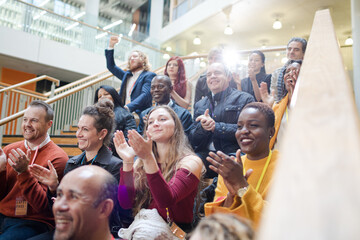 Fototapeta premium Enthusiastic audience clapping and cheering