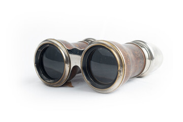 Antique binoculars on white background