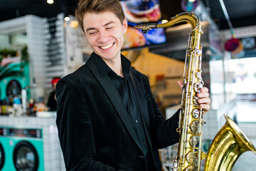 student learning to play on saxophone in the room
