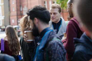 People talking outside auditorium