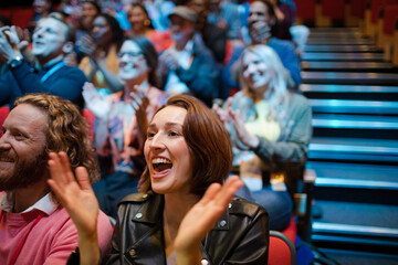 Fototapeta premium Smiling, excited audience cheering