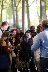People talking in hall of auditorium