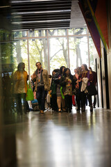 People talking in hall of auditorium