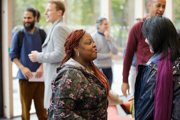 Two women greeting in hallway