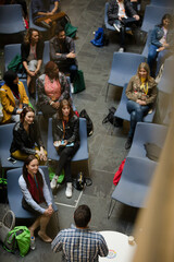 Conference audience watching speakers on stage