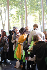 Man and woman talking in hall of auditorium