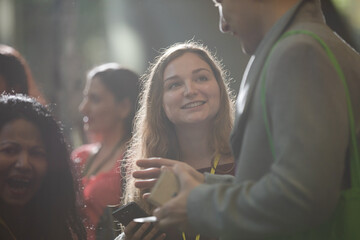 People talking in hall of auditorium