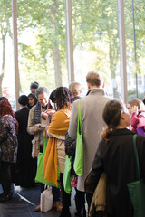 Man and woman talking in hall of auditorium