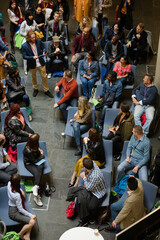 Conference audience watching speakers on stage
