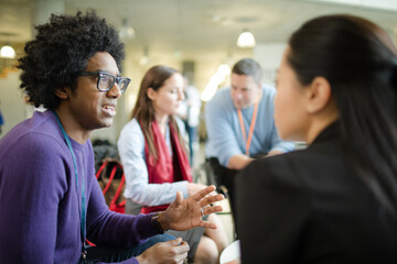 People talking in hall during conference break