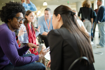 People talking in hall during conference break