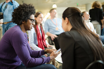 People talking in hall during conference break