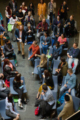 Conference audience watching speakers on stage