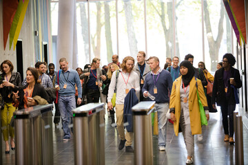 People entering auditorium hallway