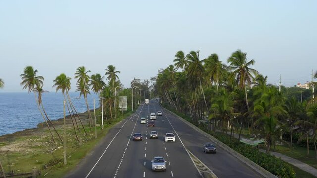 Lots of cars on the highway along the Caribbean sea. Santo Domingo, Dominican republic