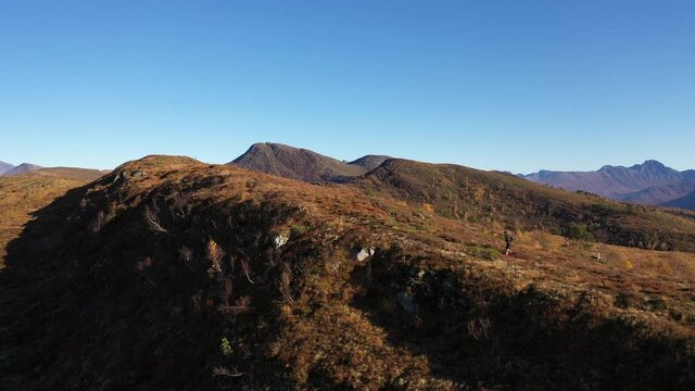 Orbiting a person running on a mountain in Volda, Norway.