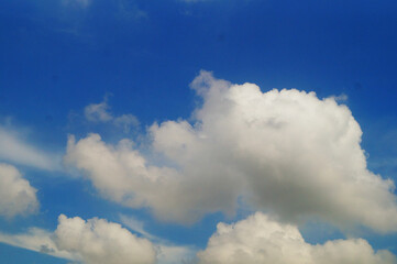 Naklejka na ściany i meble Blue sky, white clouds and buildings