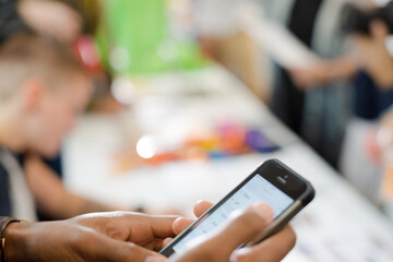 Man using phone in auditorium hall