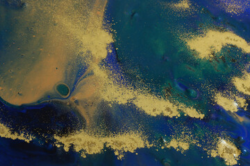 art photography of abstract marbleized effect background with black, gold and blue creative colors. Beautiful paint.