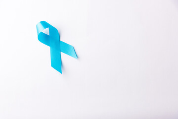 November light blue ribbon, studio shot isolated on white background, Prostate cancer awareness month, men's health concept