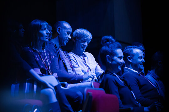 Enthusiastic audience clapping and cheering