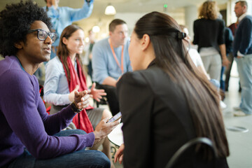People talking in hall during conference break