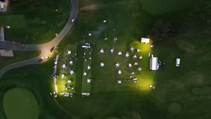 4K Drone shot of catered party on a golf course