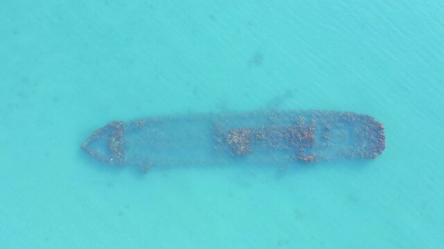 Boat Wreck On Seabed In Shallow Blue Water, Ogano British Trawler, Top Down