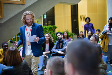 Audience watching speaker on stage