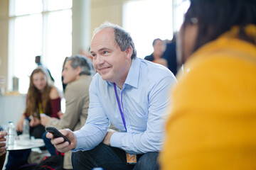 Naklejka premium People talking during conference break