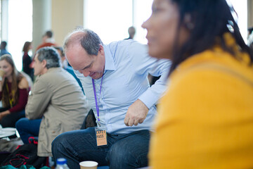 Naklejka premium People talking during conference break