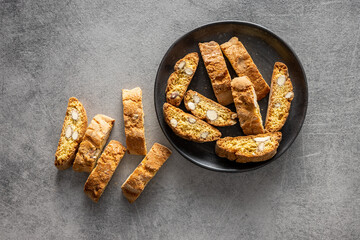 Italian cantuccini cookies on plate. Sweet dried biscuits with almonds.