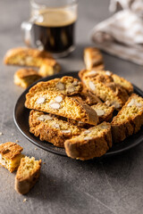 Italian cantuccini cookies on plate. Sweet dried biscuits with almonds.