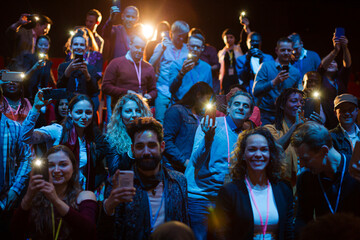 Smiling, excited audience cheering