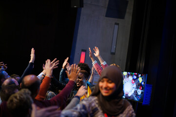 Audience reaching for and talking with speakers