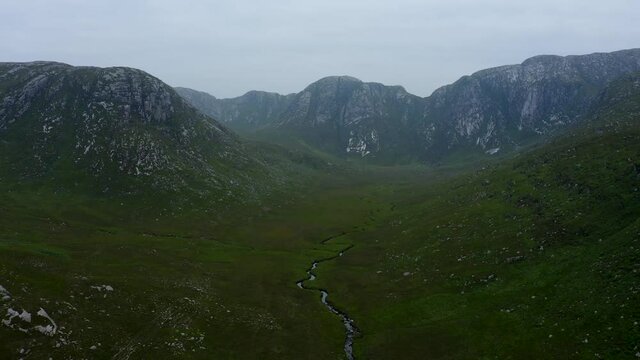 Poisoned Glen, Dunlewey, Gweedore, County Donegal, Ireland, September 2021. Drone gradually pulls north following a tributary to the Devlin River in Derryveagh Mountains.